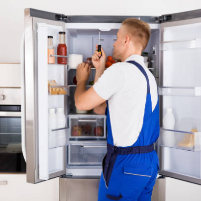 technician-repairing-refrigerato